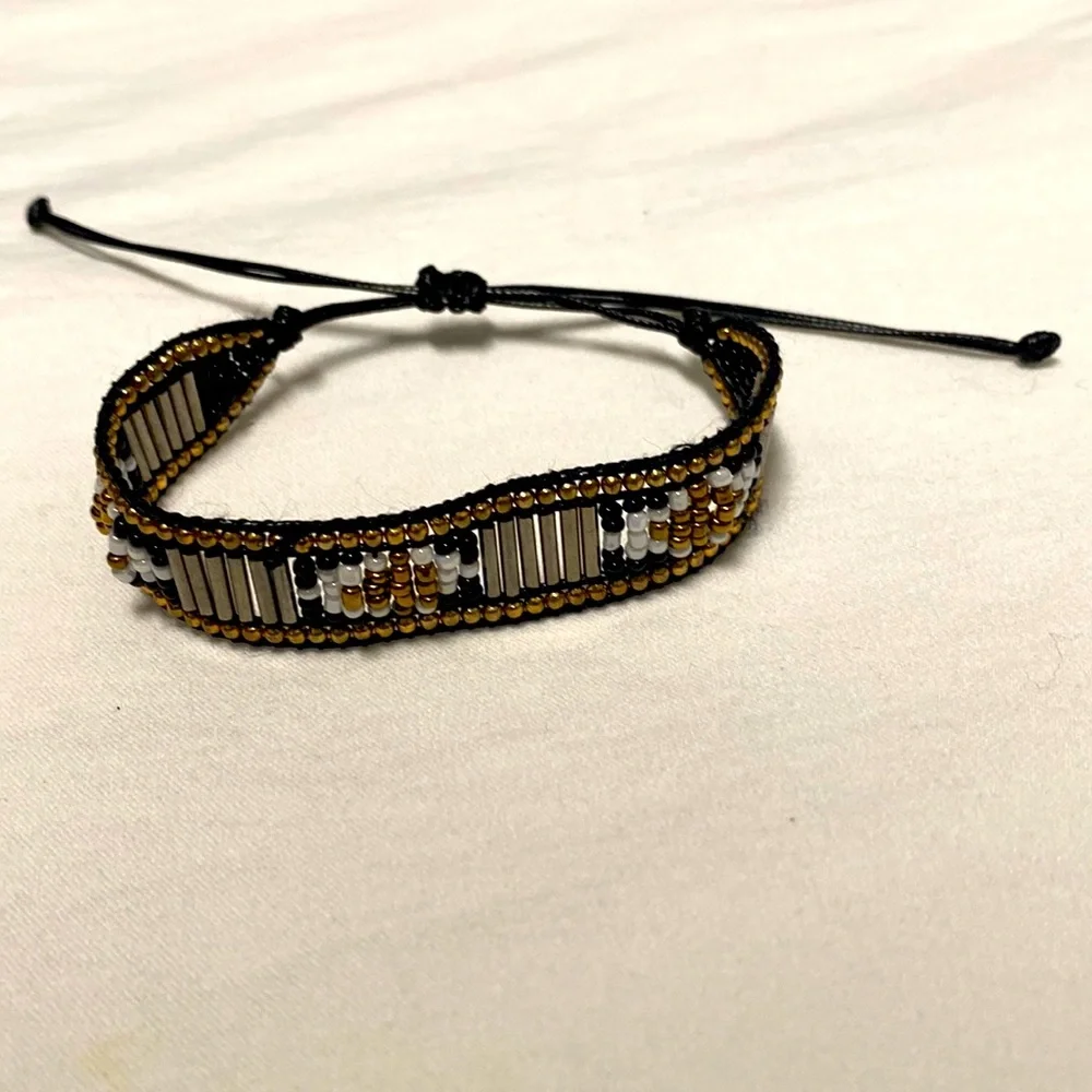 Gold black white and silver beads on black cord Adjustable Size Bracelet. - Picture 1 of 5